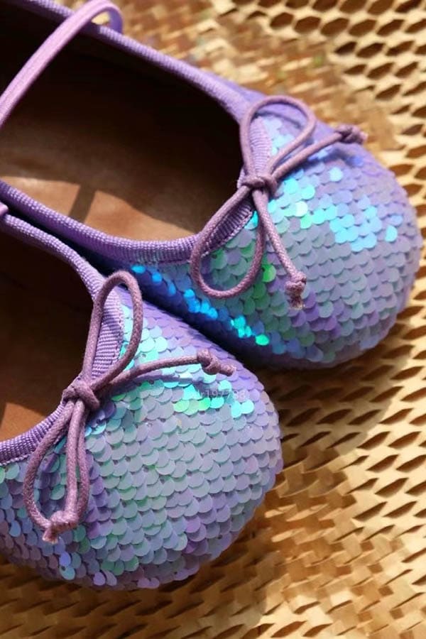 Purple leather ballet flats for a girl