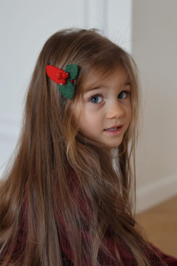 Green and red Christmas tree hair clip for a girl, made from soft felt