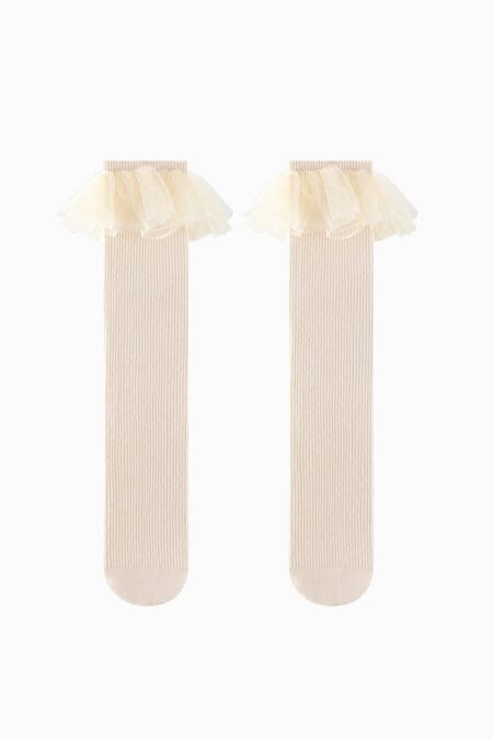 Calze al ginocchio color crema per bambine con balze in tulle decorative. Design morbido e delicato.