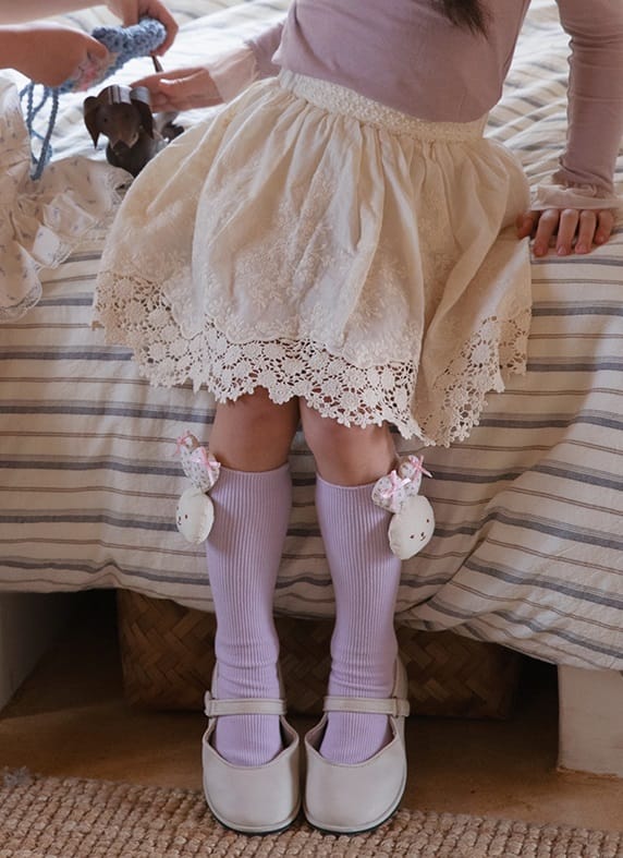 Purple Easter socks for a girl with plush bunnies