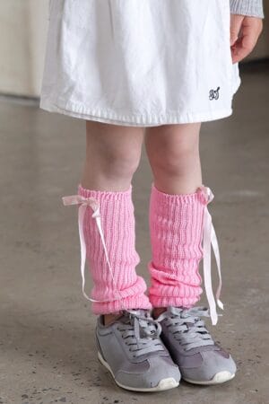 Pink leg warmers with a bow