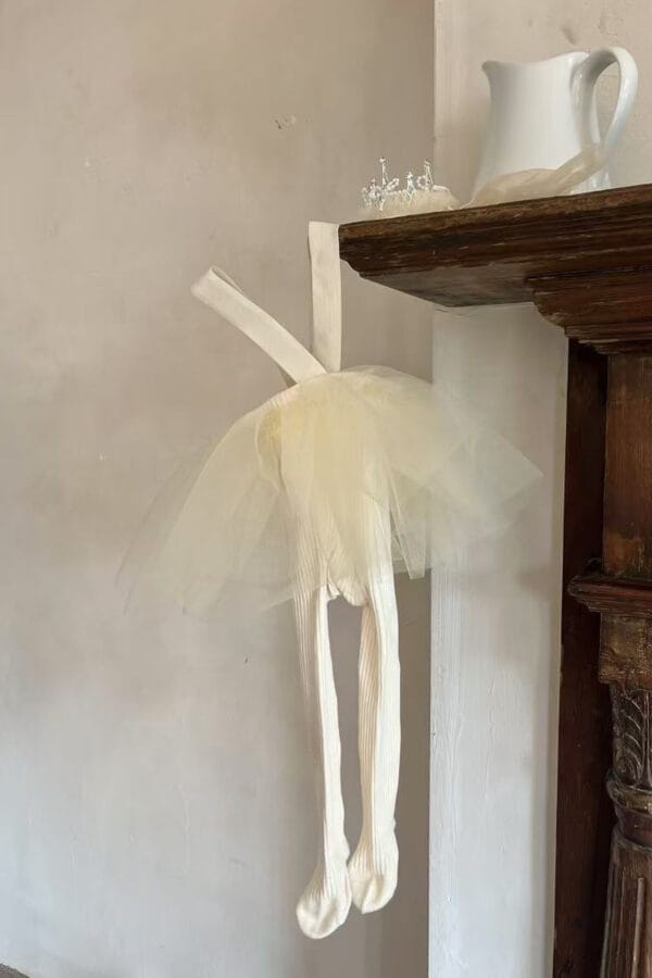 Yellow tights with tulle frills and braces for a girl