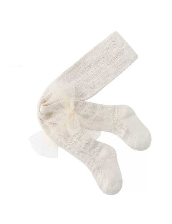 Cream openwork tights with a tulle bow for a girl, delicate pattern