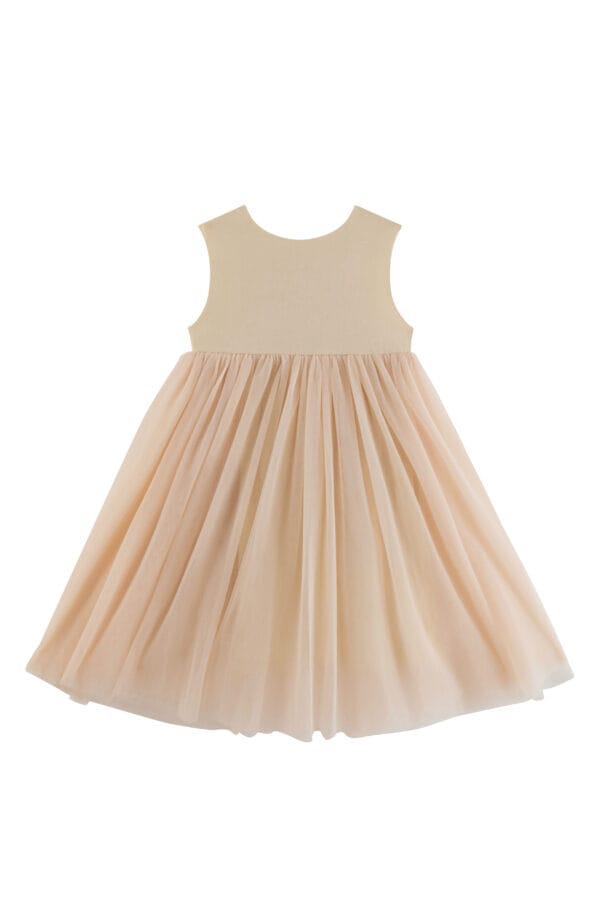 Dress for a girl in cream pink with a tulle bottom and a simple top.