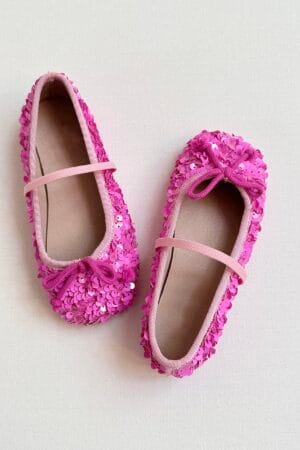 Rosa paillettenbesetzte Ballerinas für Mädchen, mit Gummiband und Schleife.