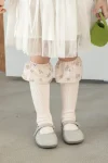 Calcetines hasta la rodilla con volante y estampado de flores