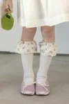 Calcetines hasta la rodilla azul celeste con volante floral