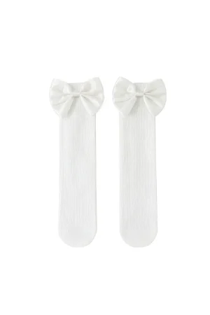 White socks for a girl with a decorative bow at the top.