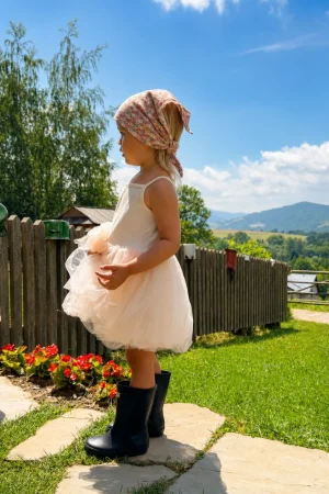 Girls’ nude pink strappy tulle dress with a pretty tulle skirt.