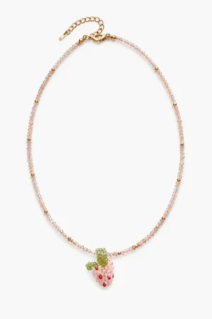 Girls' necklace with pink beads and a dangling strawberry charm.