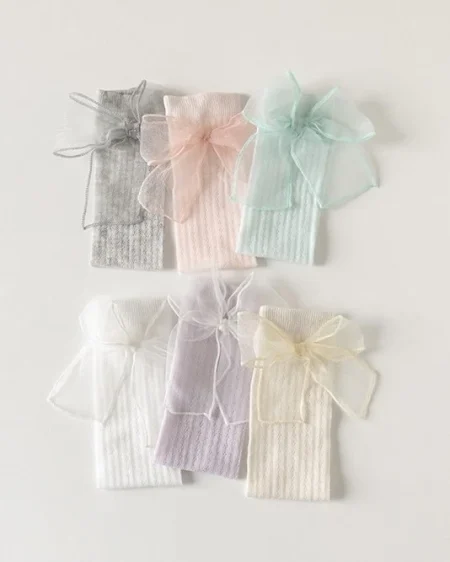 Set di delicate fasce per bambina in colori pastello: grigio, rosa, menta, bianco, viola.