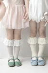Cream knee-high socks with lace and ruffle
