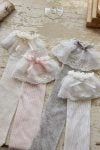 Light pink knee-high socks with lace and a ruffle
