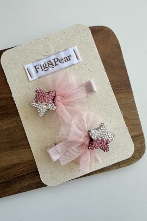 Girls' star-shaped hair clips in pink and silver with tulle bows.